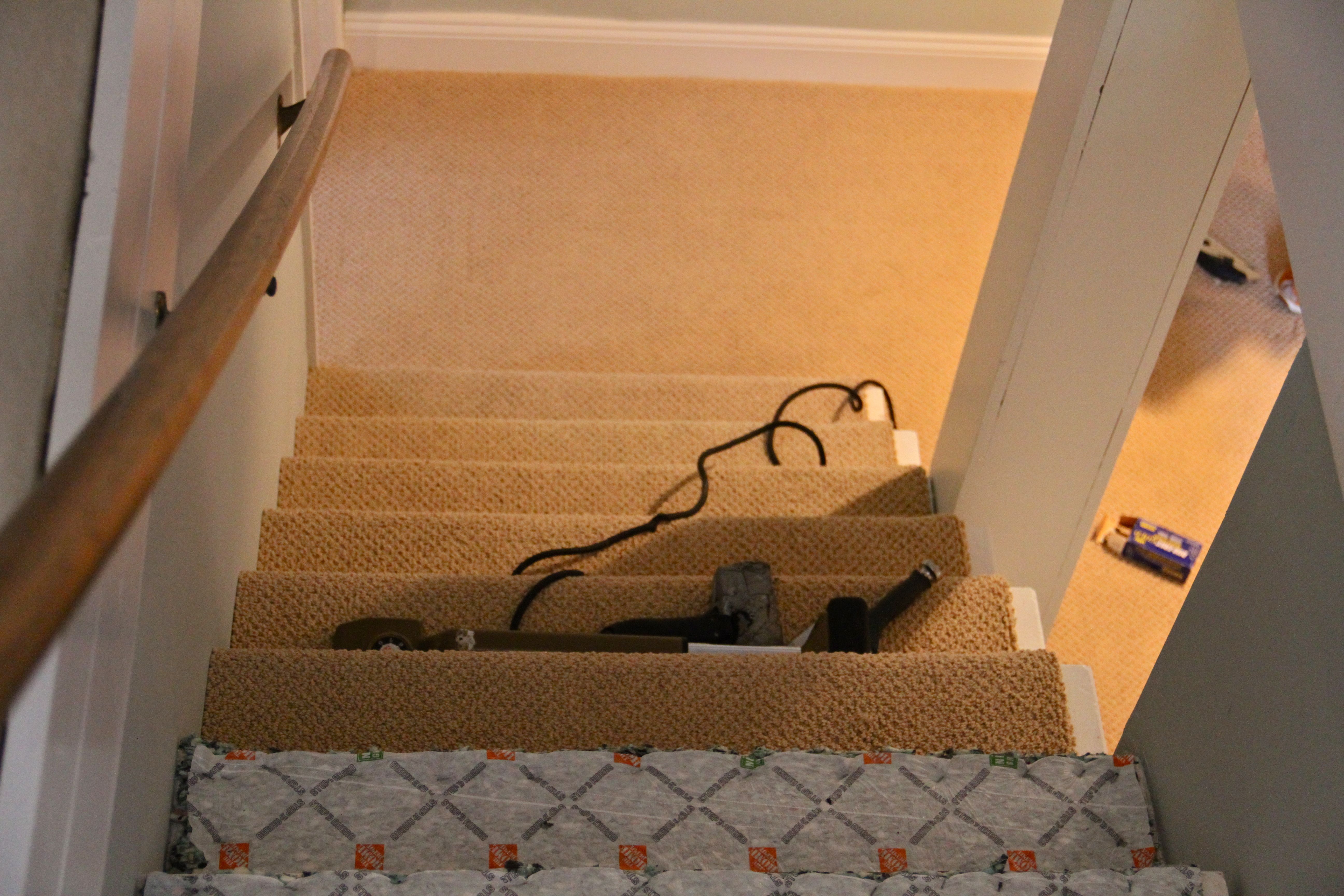 DURING: We ended up having the carpet tucked underneath itself on the stairs where the sides were exposed to the room. It made for a good compromise: no 80s stair wrap, and a bit of exposed white to add to the crisp freshness of the trim throughout the space.