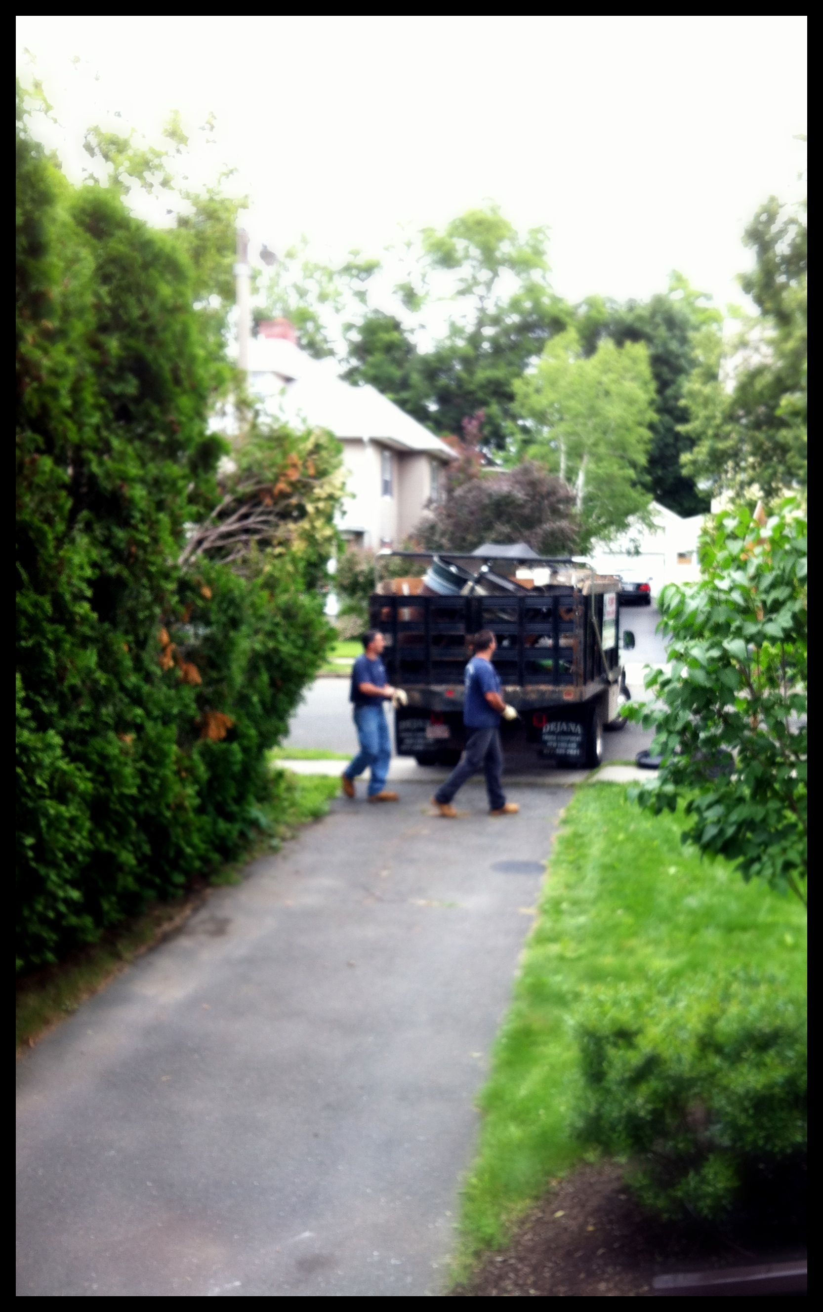 The guys of Prompt Removal Service promptly removing their truck from our too narrow driveway.