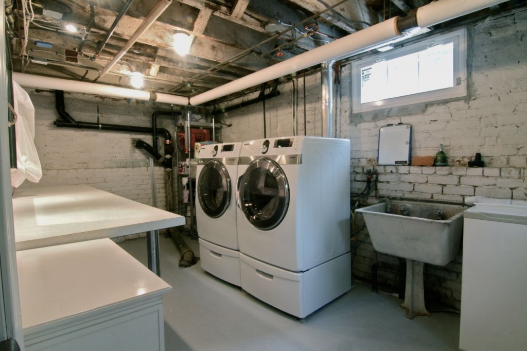 Laundry room. New washer and gas dryer installed in 2009. Folding area, freshly painted floors and new lighting.