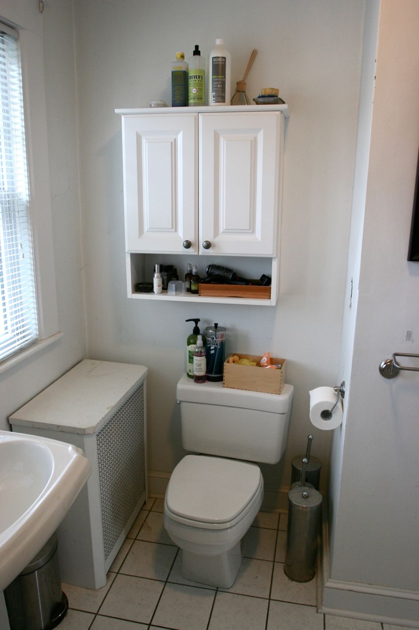 BEFORE: The aging toilet, the pitiful cabinet, the sad little radiator cover all had to go. Clearly, it wasn't working.