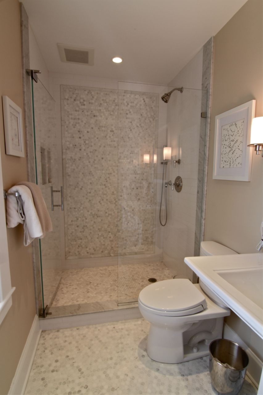 AFTER: Master bath, with custom shower, marble hexagon tile, heated floors and brand new everything.