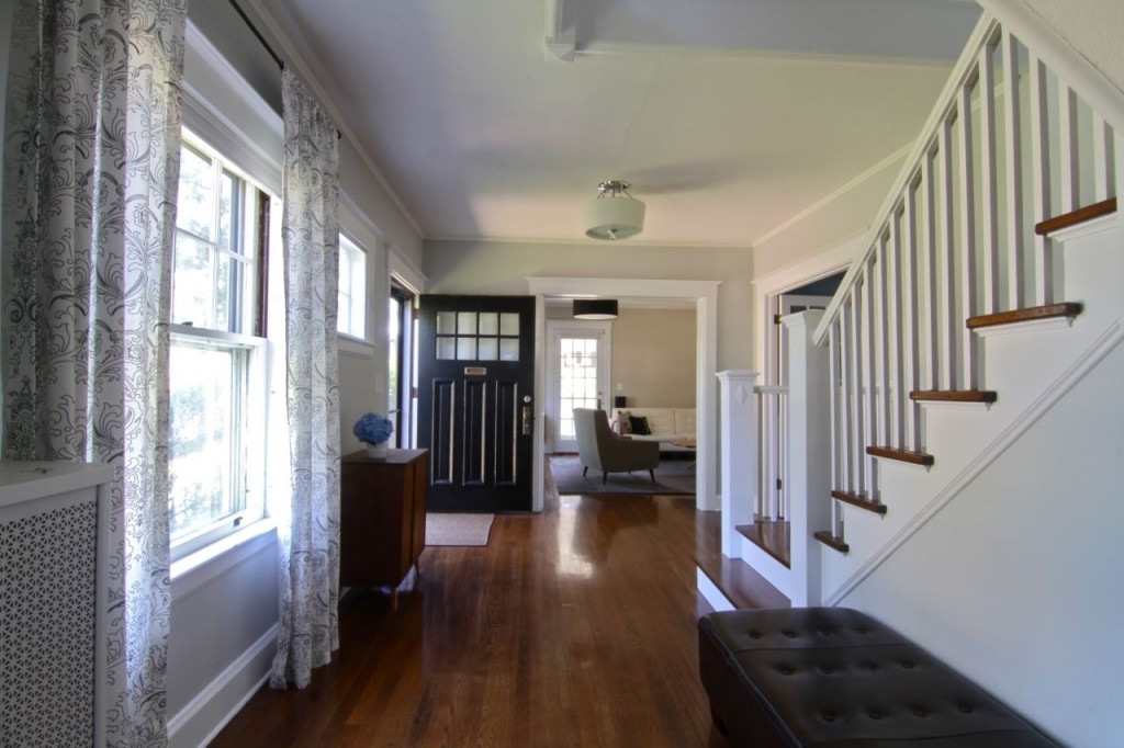 The foyer, or entryway, is both grand and homey. It connects virtually every space in the house, especially when you take into account that the two-story entrance snakes continues on through the hall that connects all the bedrooms upstairs.