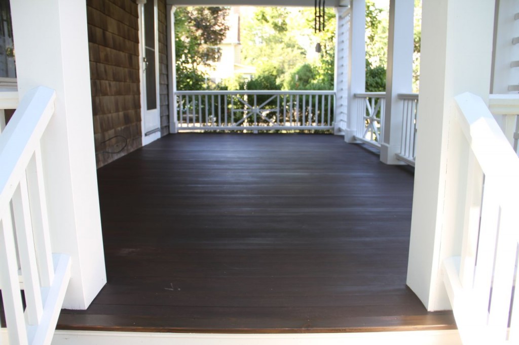 AFTER: With a new coat of rich brown the porch floor again resembles the rich, dark pine mulch we use that looks like fertile soil. I love the natural way it blends with the landscape, while providing a grounded and expansive visual plane.