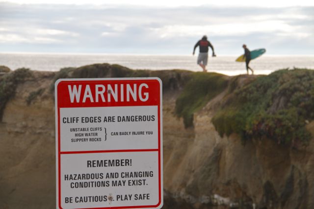 And they pretty much ignored all the signs that told them to be careful of the sea. Fathers teaching their sons early about the powers of surfing.