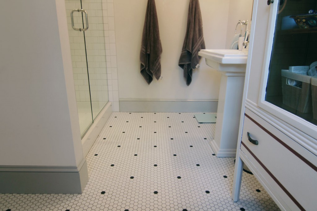 More floor space means that it's easier for two people to get ready at the same time. The homeowners never used their double sink in their old house, so we opted for space over spending money on materials that would go unused. 