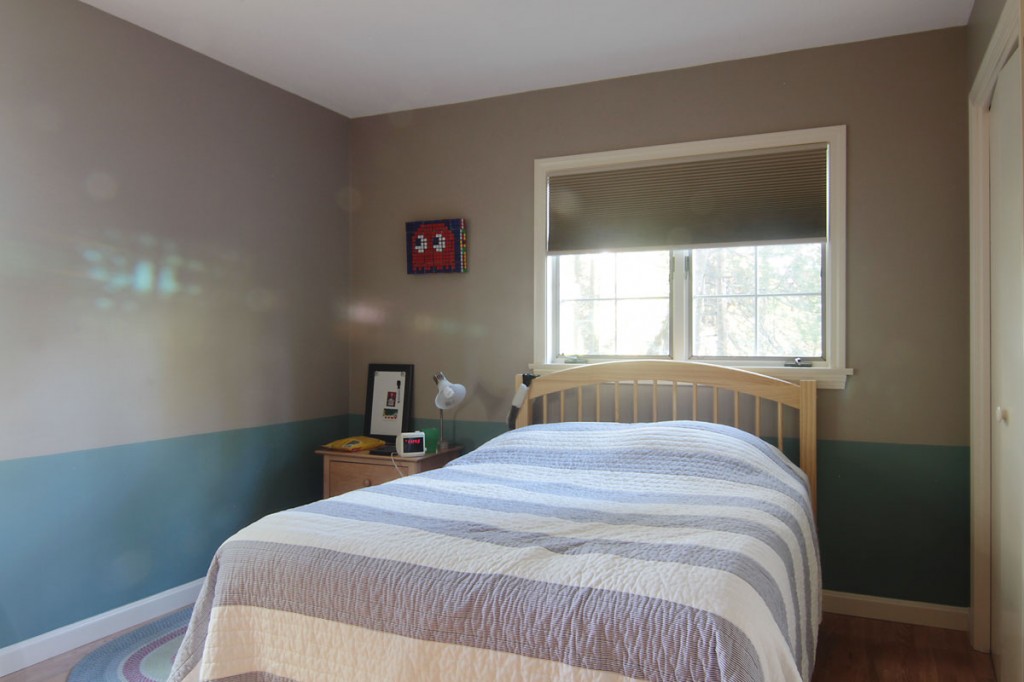 The painted chair rail adds a bit of interest in this primarily neutral space, but doesn't take our young person too far outside his personal comfort zone.